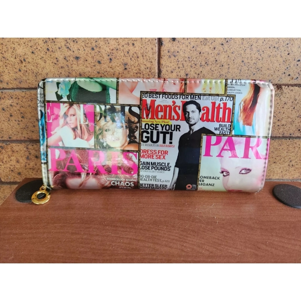 Fashion magazine cover wallet with gold colored zipper and zipper pull